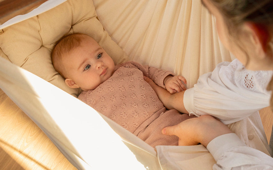 When can babies hold their head up?